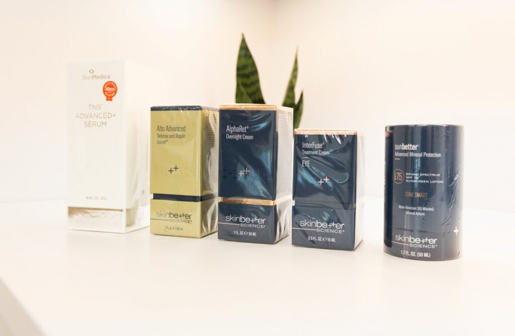 A grouping of medical grade skincare products on a shelf, showing just a small sample of the full offerings of our medical grade skincare in Dallas.